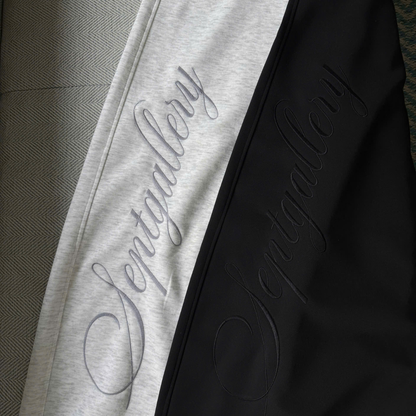 Close-up of a black and gray garment with 'Santgallery' branding.